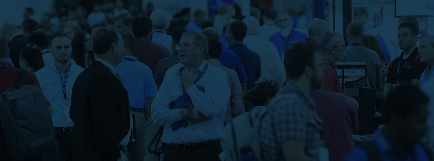 Attendees and exhibitors walking the expo hall