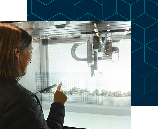 Woman pointing at plastic objects in a display