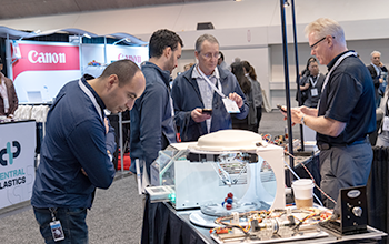 Expo attendee looking at medical devices 